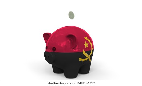 Coins Fall Into Piggy Bank Painted With Flag Of Angola. National Banking System Or Savings Related Conceptual 3D Rendering