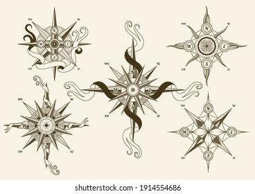 Collection of vintage nautical compass. Old design elements for marine theme and heraldry. Hand drawn wind roses