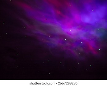 Colored patterns on the ceiling, similar to a starry sky, formed by the light of a lamp