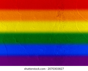 Colored spray on the cement surface of the wall. Graffiti in the colors of the rainbow. 