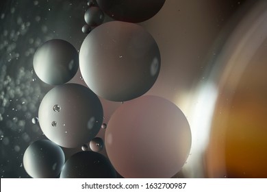 Colorful background illuminated with light and painted on water. 