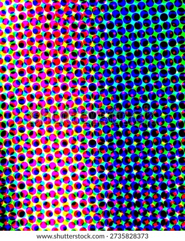 A colorful halftone pattern composed of multicolored dots in various colors including red,...