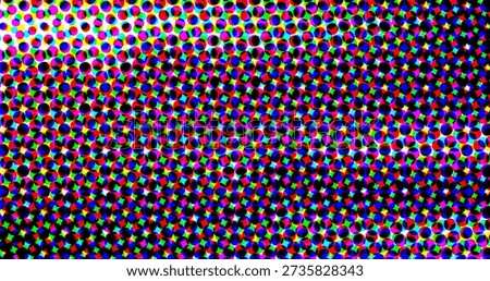 A colorful halftone pattern composed of small circles and crosses in various colors, including...