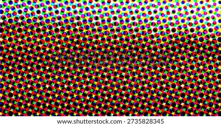 A colorful halftone pattern composed of small circles in various colors, including red, blue,...