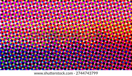 A colorful halftone pattern composed of small circles in various colors, including red, blue,...
