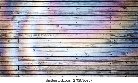 Colorful iridescent light diffraction creating a moving circular pattern on wooden planks