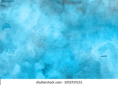 Colorful winter blue ink and watercolor textures on white paper background. Paint leaks and ombre effects.