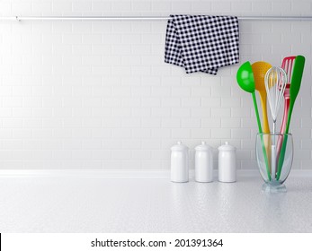 Colour Utensils On The White Worktop. Kitchen Interior.