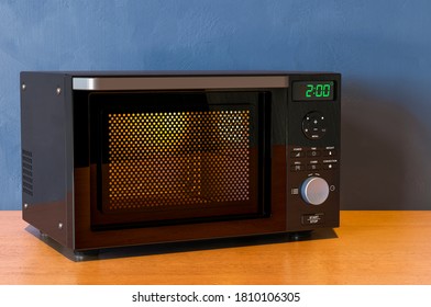 Combination Oven, Microwave On The Wooden Table. 3D Rendering