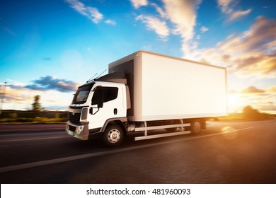 Commercial Cargo Delivery Truck With Blank White Trailer Driving On Highway. Generic, Brandless Vehicle Design. 3D Rendering