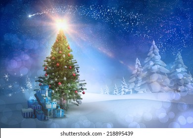 Composite Image Of Christmas Tree With Gifts Against Snowy Landscape With Fir Trees