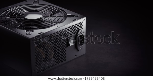 Computer AC power supply unit on black\
background. 3d\
illustration