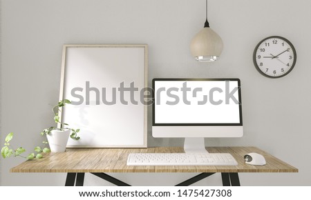 computer with blank screen  and decoration in office room mock up background.3D rendering