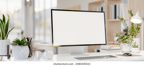 A computer desk featuring a computer with a white-screen mockup, books, headphones, and decorative plants. place of work concept. 3d render, 3d illustration