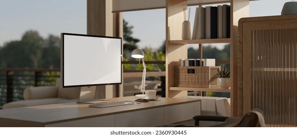 A computer desk with a white screen computer mockup in a modern contemporary home office. Home workplace concept. 3d render, 3d illustration