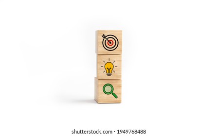 Concept of business strategy and action plan. Wooden cube block with icon target, light bulb and search on white background. 3D rendering.