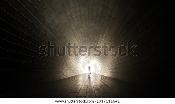 Concept or conceptual dark tunnel with a\
bright light at the end or exit as metaphor to success, faith,\
future or hope, a black silhouette of walking man to new\
opportunity or freedom 3d\
illustration