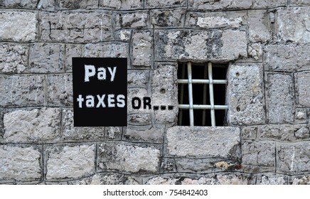 The Concept Of The Consequences Of Tax Evasion. The Inscription On The Prison Wall: Pay Taxes Or ...