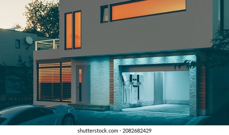 Concept Of A Home Battery Energy Storage System Located In The Garage Of A Modern Family House In A Futuristic Blue Light Illuminating The Evening Atmosphere Of A Quiet Street. 3d Rendering.