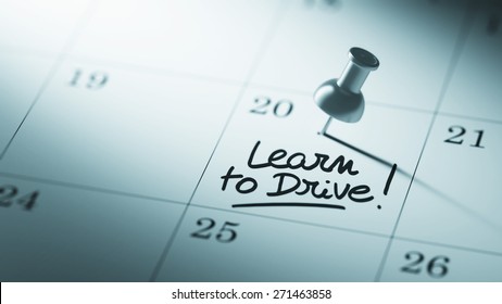 Concept image of a Calendar with a push pin. Closeup shot of a thumbtack attached. The words Learn to Drive written on a white notebook to remind you an important appointment. - Powered by Shutterstock