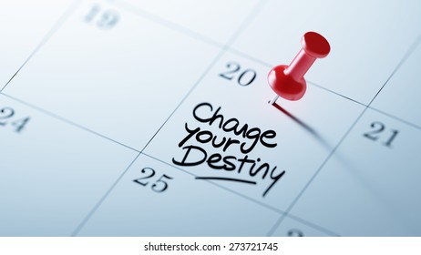 Concept image of a Calendar with a red push pin. Closeup shot of a thumbtack attached. The words Change your destiny written on a white notebook to remind you an important appointment.