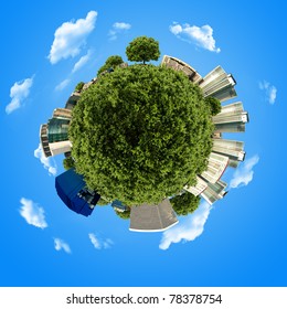 concept miniature globe with building and forest on blue sky background