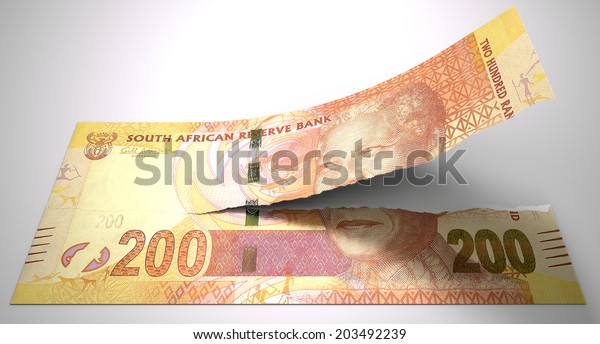 A\
concept picture of a regular South African two hundred rand note\
tearing in two length ways on an isolated\
background