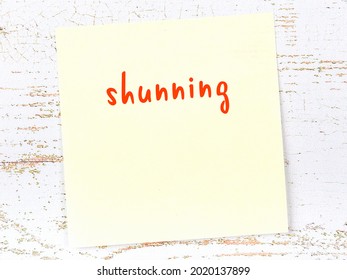 Concept Of Reminder About Shunning. Yellow Sticky Sheet Of Paper On Wooden Wall With Inscription