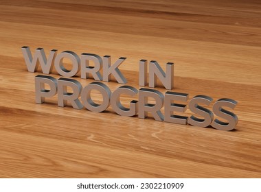 Conceptual 3D rendering of the phrase WORK IN PROGRESS in brushed metal on wood desktop background.