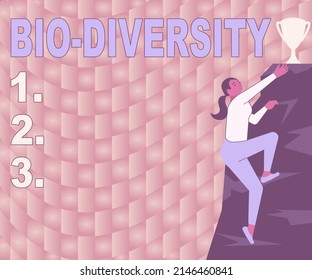 Conceptual Caption Bio Diversity. Concept Meaning Variety Of Life Organisms Marine Fauna Ecosystem Habitat Woman Climbing Mountain Reaching Trophy Representing Success.