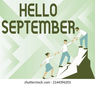 Conceptual caption Hello September. Word for Eagerly wanting a warm welcome to the month of September Colleagues Climbing Upwards Mountain Reaching Success Presenting Teamwork. - Powered by Shutterstock