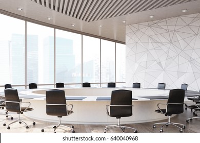 Conference room interior with a round table, black office chairs near it, a marble wall and a panoramic window. 3d rendering, mock up
