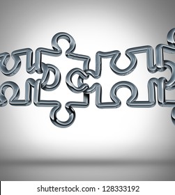 Connection Bridge And Bridging The Gap In Business Cooperation As A Concept With A Group Of Three Dimensional Metal Chain Links In A Network Of Puzzle Pieces Connected Together To For A Strong Team.