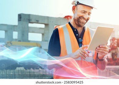 A construction worker using tablet, wearing hard hat and safety vest. Smiling construction worker on site, checking plans on tablet. Industrial engineer, professional factory worker concept. - Powered by Shutterstock - Get 15% off with code: PIKWIZARD15