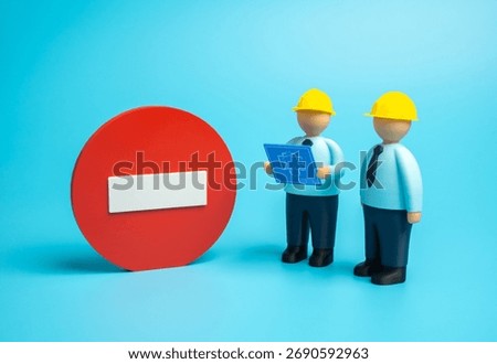 Construction workers have stopped work. Work is prohibited. Suspension of building, safety violations, and legal issues. Labor law, real estate, and industry crisis themes.