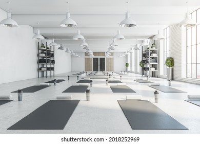 Contemporary Bright White Yoga Studio Gym Interior With Brick Wall, Window And City View. 3D Rendering