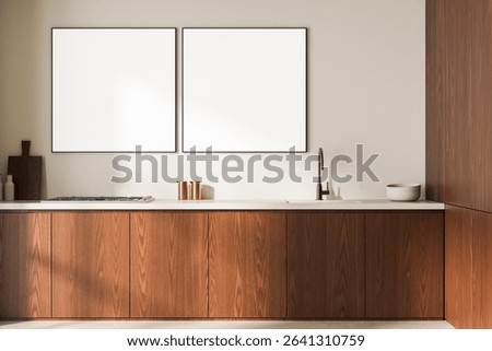 Contemporary kitchen with empty square poster frames, minimalist wood cabinets, light wall background, clean layout concept, 3D Rendering