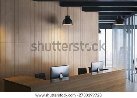 Contemporary reception desk with two computers in a modern office interior, featuring wood panel walls, pendant lights, and city view. 3D Rendering
