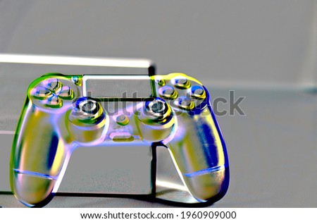 Controls and video game console on light background. Electronic game accessories. Video game gaming platform. Wish item for gamers. Modern, wireless game and directional control.