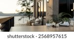 A copy space for displaying products on a wooden table with a blurred background of a cozy luxurious home balcony with a stunning nature view. 3d render, 3d illustration