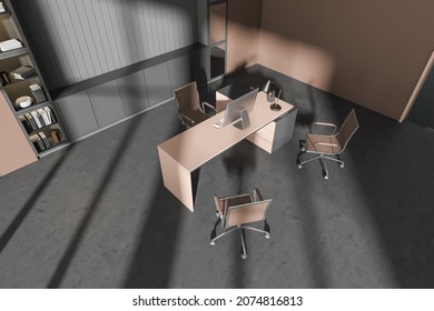 Corner Of Grey And Brown Office Interior With Desktop, Stylish Niche, Cabinets, Three Rolling Chairs And Concrete Floor. Concept Of Modern CEO Work Place Design. No People. 3d Rendering