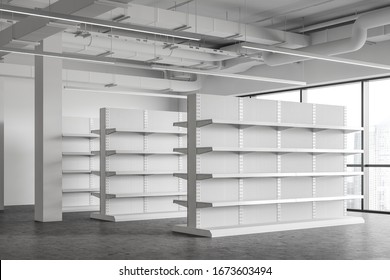 Corner Of Industrial Style Supermarket Or Warehouse With White Empty Shelves And Concrete Floor. Concept Of Consumerism And Storage. 3d Rendering