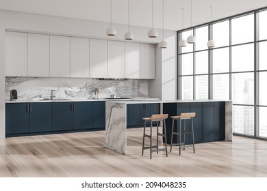 Corner Of Minimalist White And Blue Kitchen Interior With Breakfast Bar, Two Beige Stools, Pendant Lights, Panoramic Cityscape View And Parquet Floor. Concept Of Modern Design. 3d Rendering