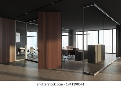 Corner Of Modern CEO Office With Gray And Glass Walls, Wooden Door, Comfortable Computer Table With Chairs For Visitors And Blurry Cityscape. Concept Of Leadership. 3d Rendering