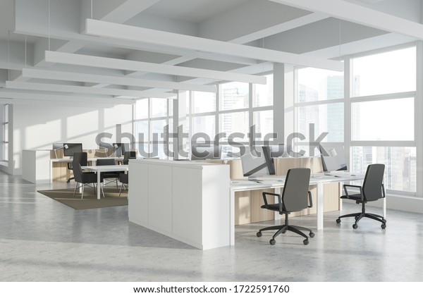 Corner of modern\
Industrial style open space office with white walls, concrete\
floor, rows of computer tables and panoramic windows with blurry\
cityscape. 3d\
rendering