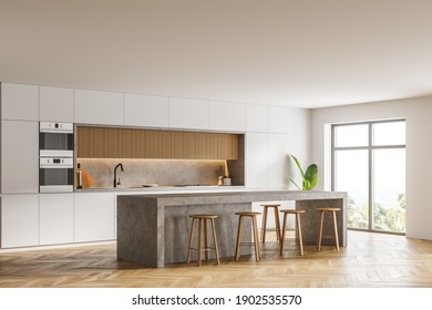 Corner Of Modern Kitchen With White Walls, Wooden Floor, Bar Counter And Two Ovens. Window With Blurry View. 3d Rendering