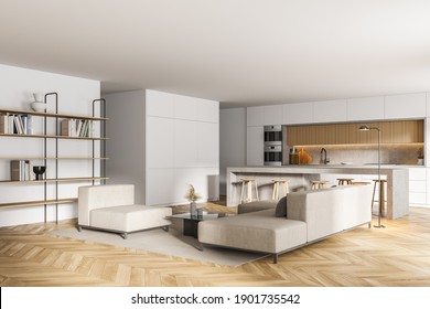 Corner Of Modern Living Room With White Walls, Wooden Floor, White Sofas And Kitchen In The Background. 3d Rendering