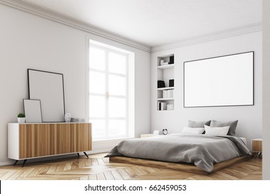 Corner of a modern luxury bedroom with white walls, a large bed in the center of the room, two bookcases by its sides, a large window and a framed horizontal poster. 3d rendering mock up