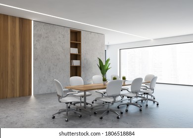 Corner Of Modern Meeting Room With Concrete And Wooden Walls, Long Conference Table And White Chairs. 3d Rendering