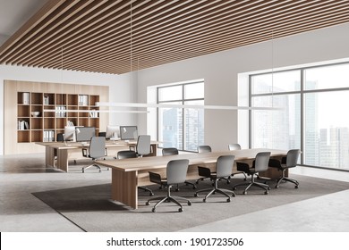 Corner Of Modern Office Meeting Room With White And Wooden Walls, Concrete Floor, Long Conference Table And Open Space Area In Background. 3d Rendering